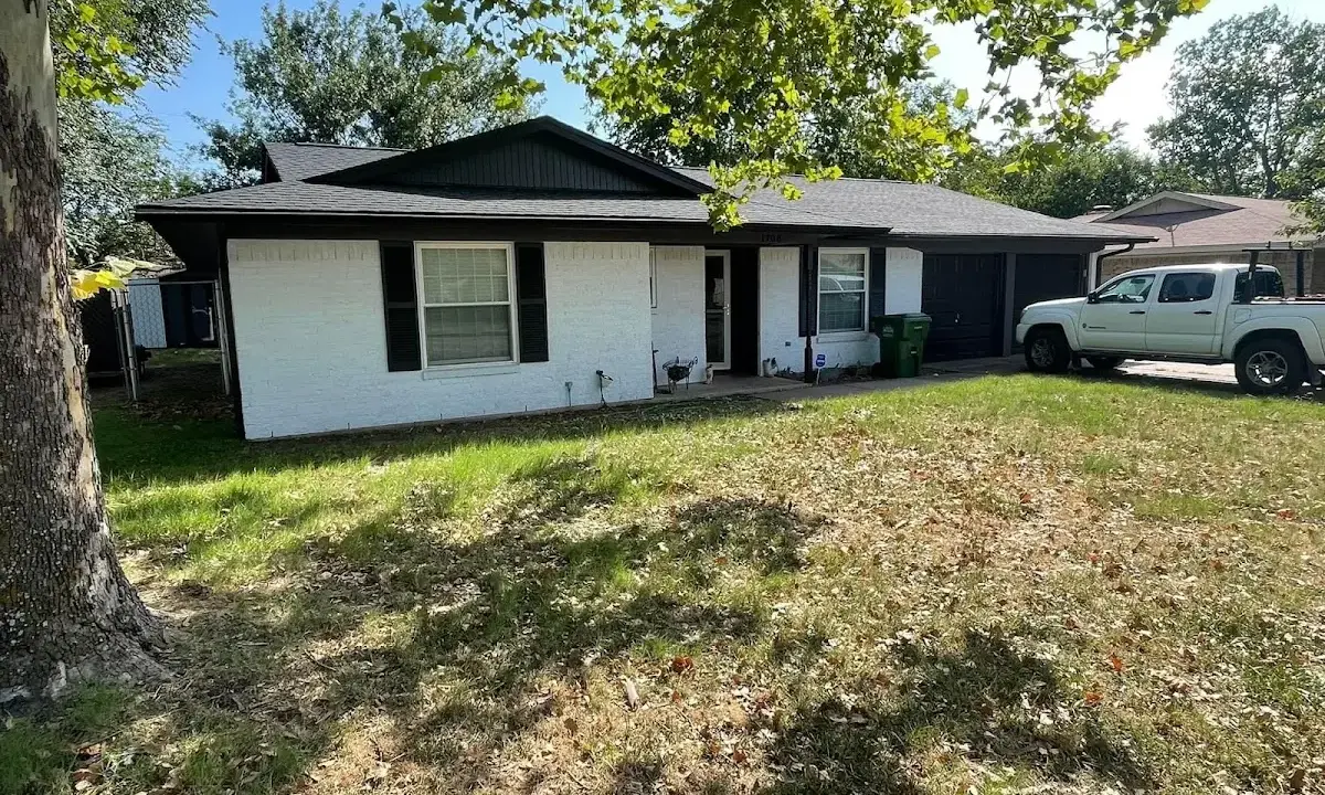 Professional roofing crew working on a residential roof in Princeton